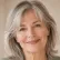 Portrait of a smiling older woman with grey hair