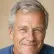 Portrait of a smiling older man with grey hair